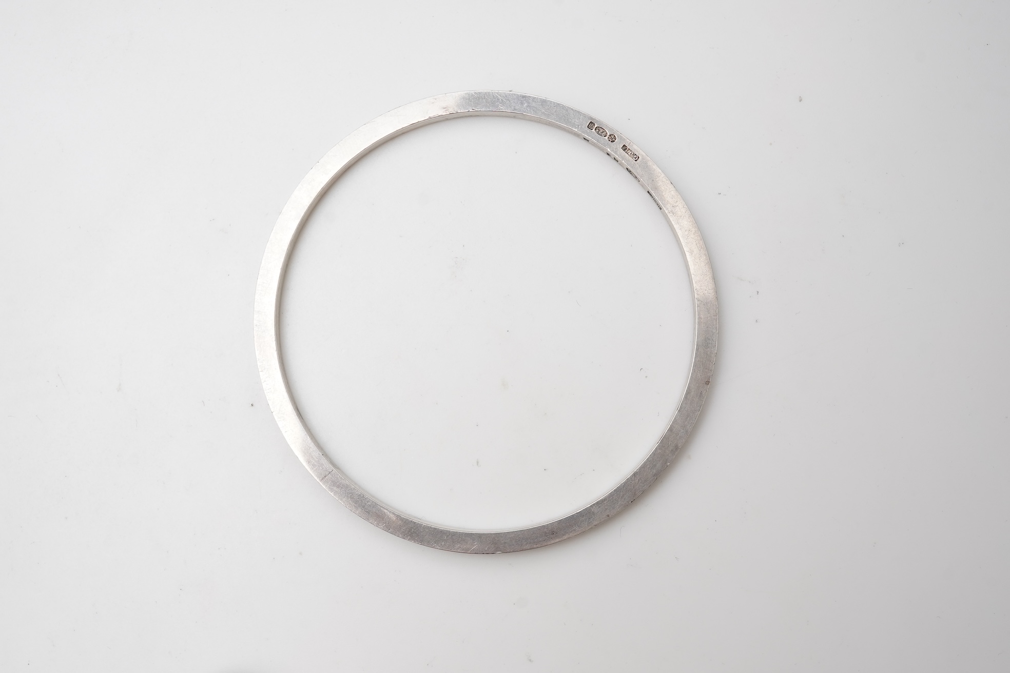 Georg Jensen, a bangle, circa 1964, and brooch, second half 20th century